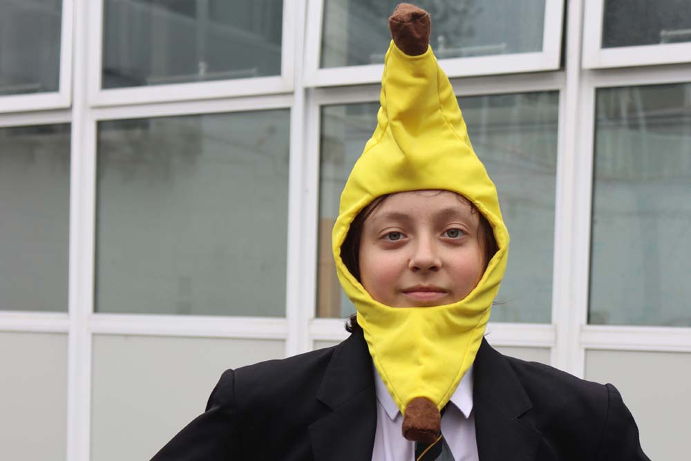 HelloYellow Day YoungMinds 2026 A student wearing a yellow banana accessory on HelloYellow Day